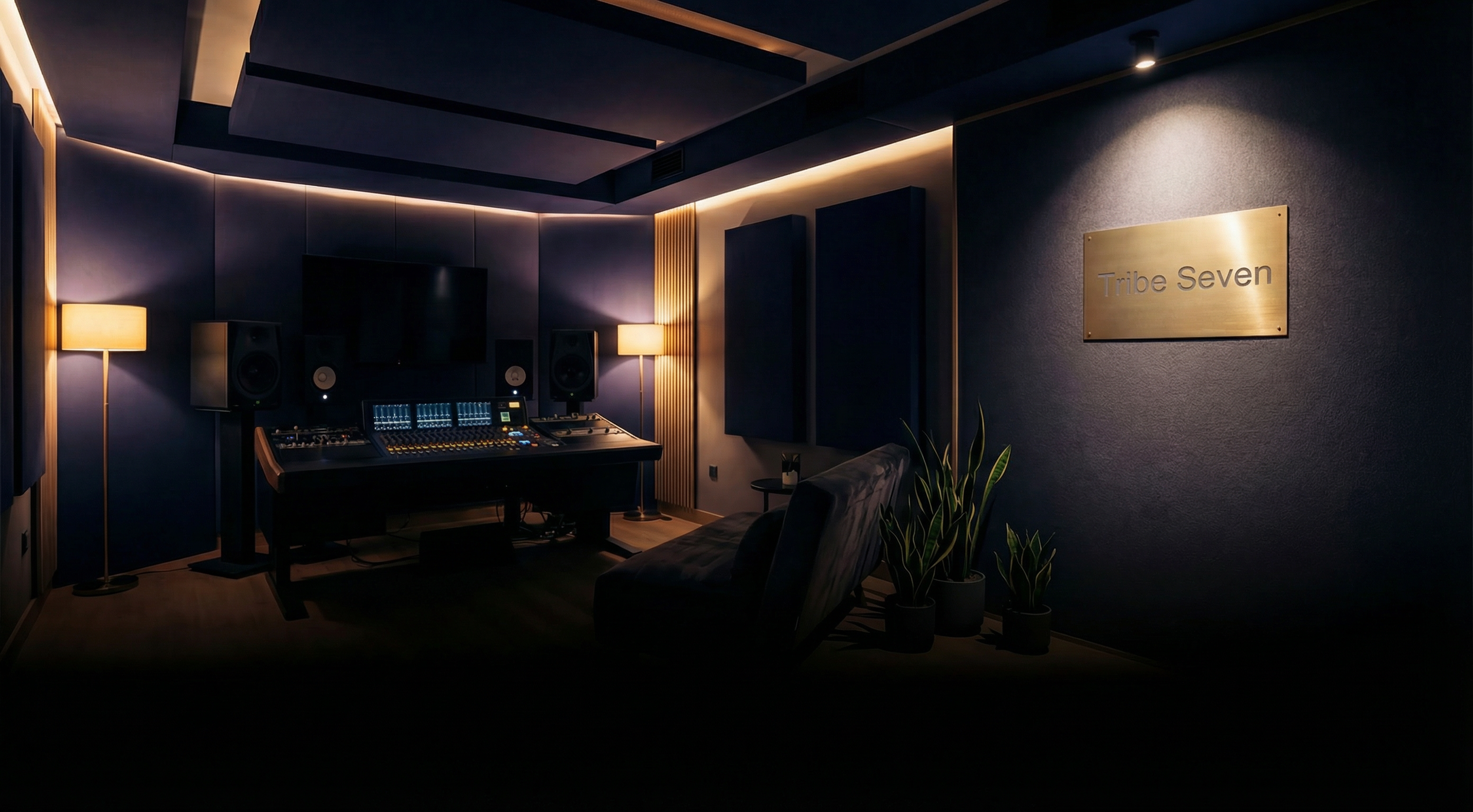 Tribe Seven recording studio — mixing desk, acoustic panels, warm light