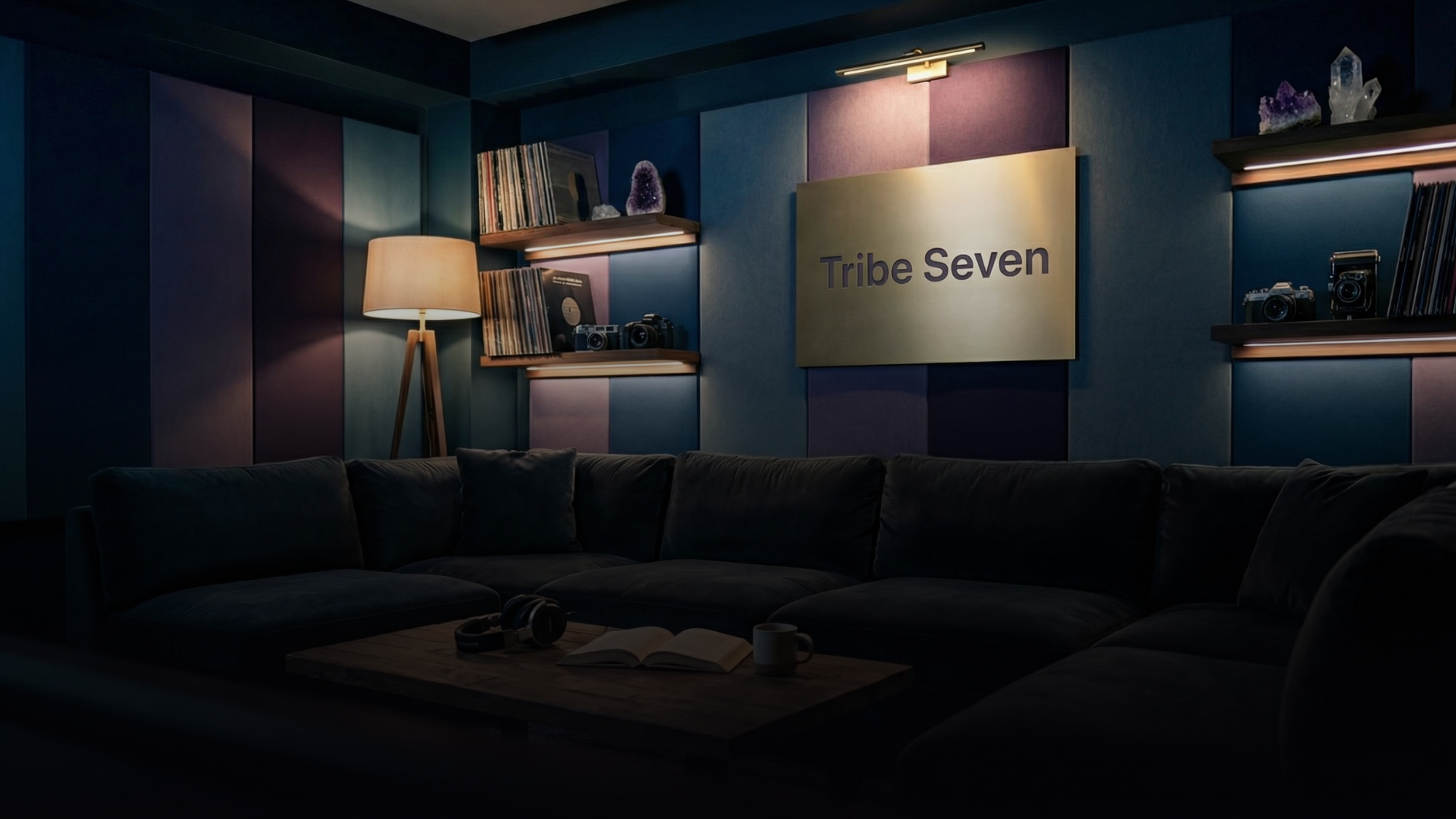 Tribe Seven studio interior — dark plush reception with the Tribe Seven plaque